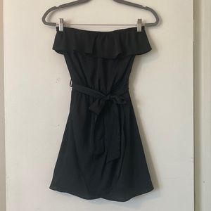 Lush black strapless mini dress with ruffle top and tulip hem